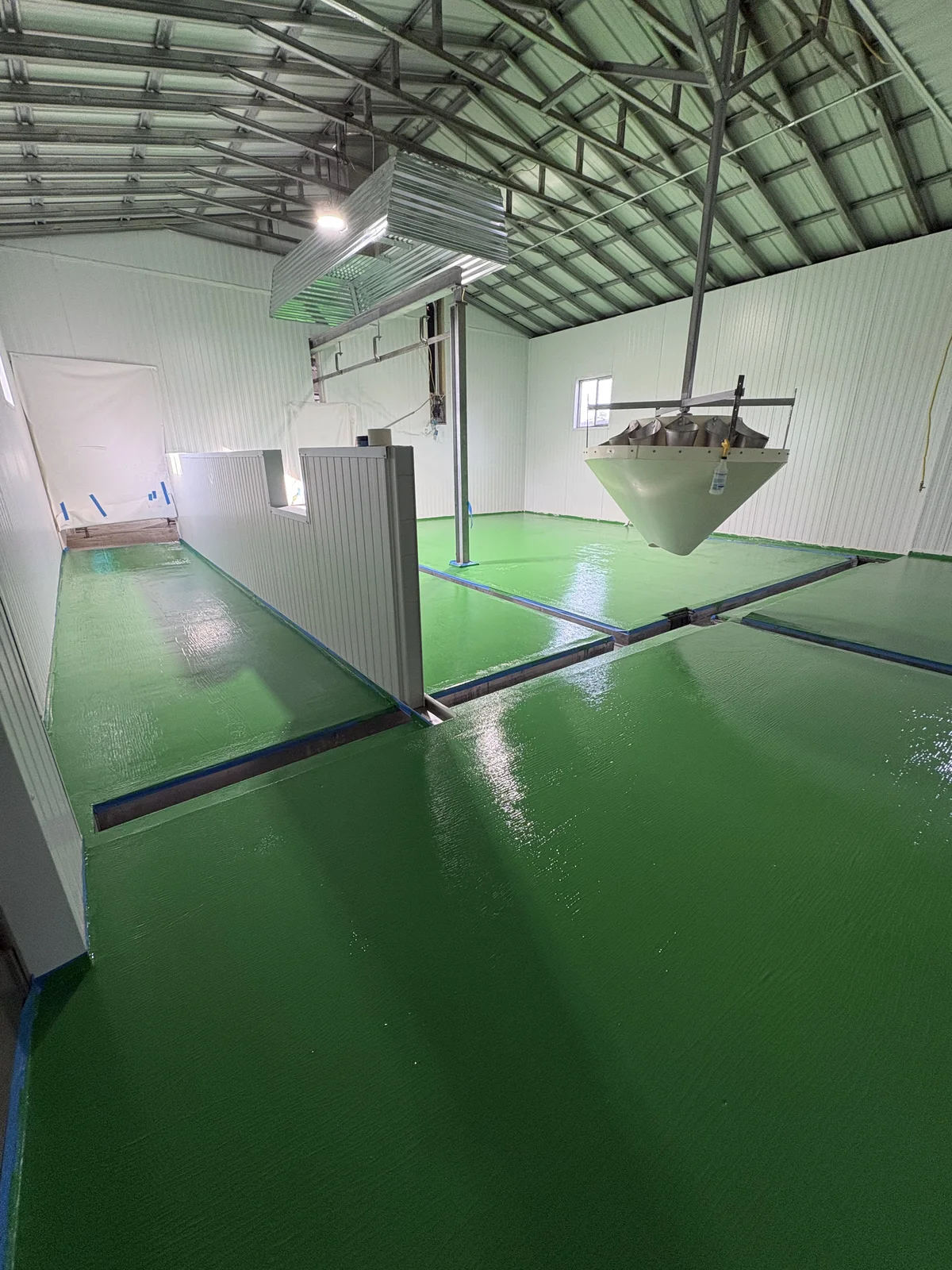 Interior space with finished green floor after transformation