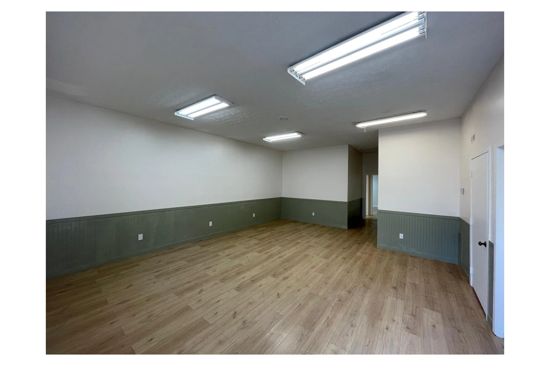 Completed interior renovation with finished flooring and walls
