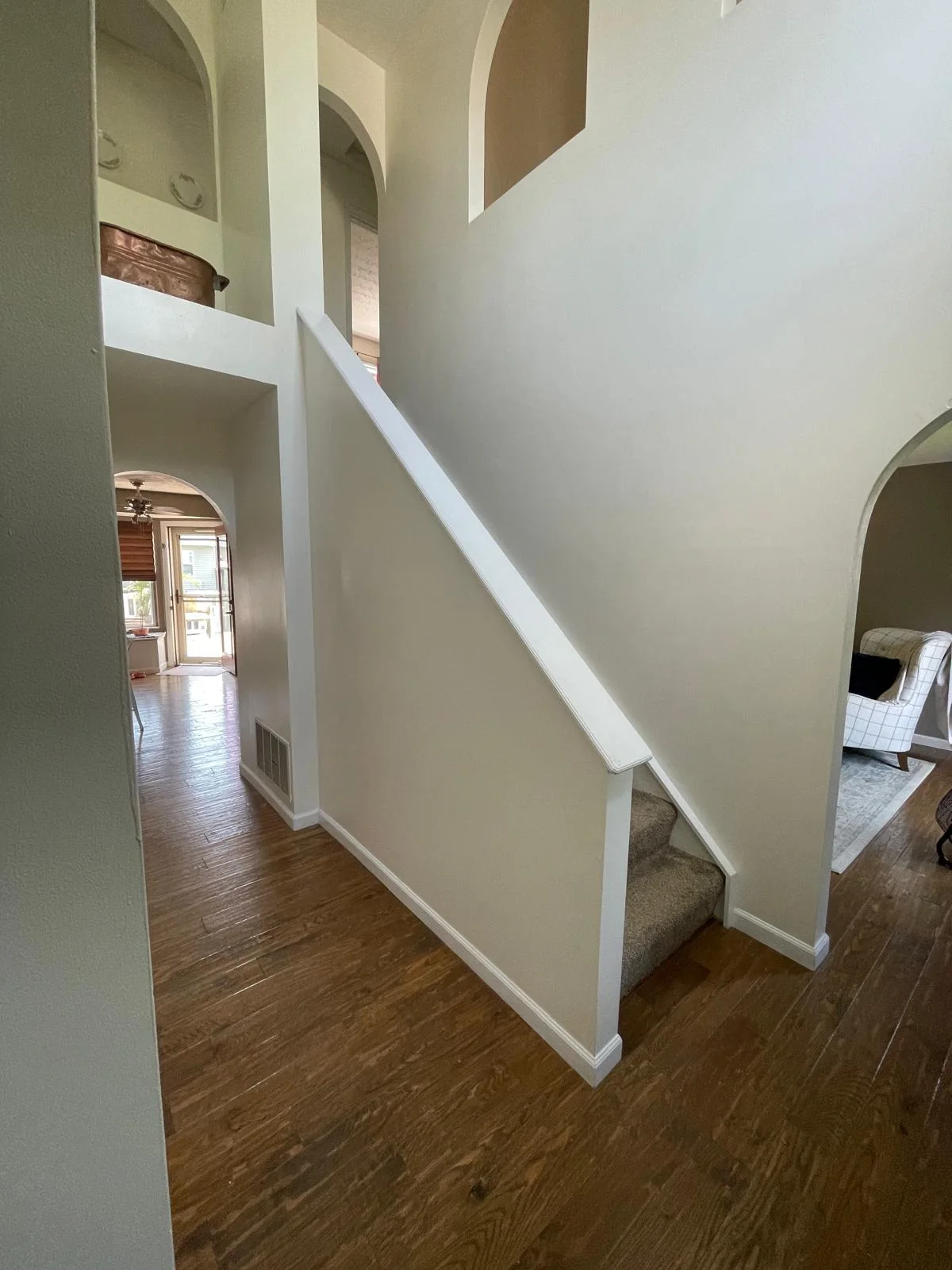 Completed staircase improvement viewed from the entry